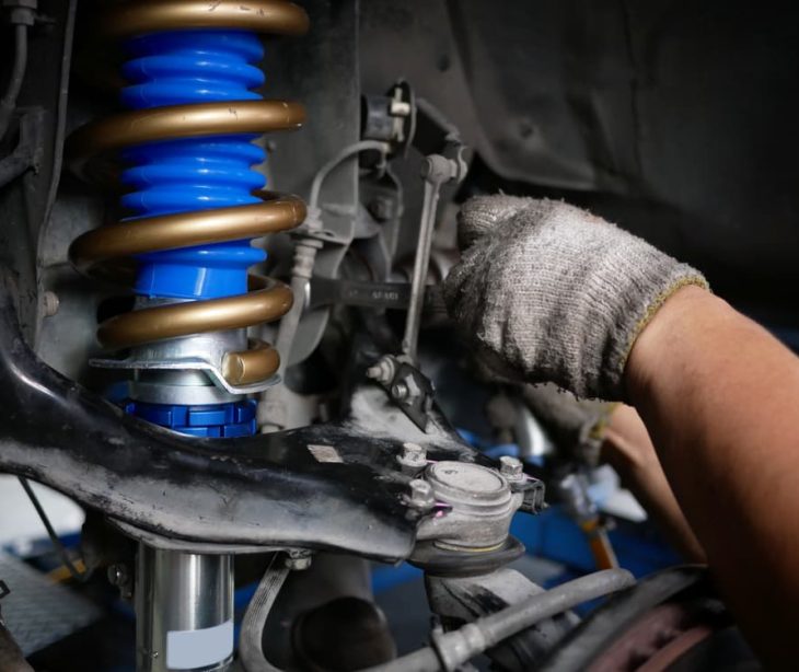 Car shock absorber getting fixed — Experienced Mechanics in Tamworth, NSW